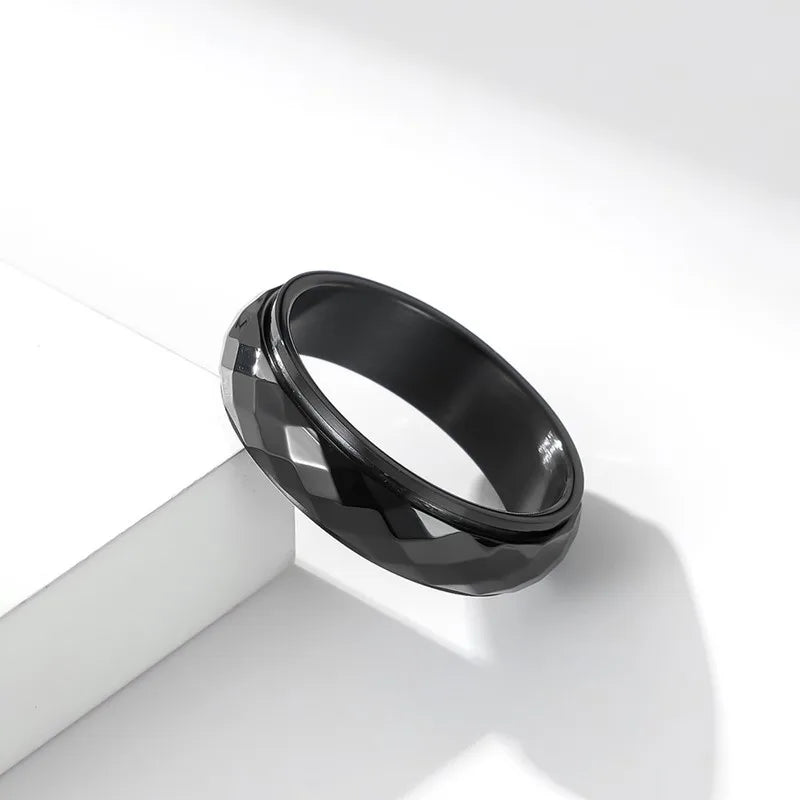 Anillo giratorio facetado de acero inoxidable