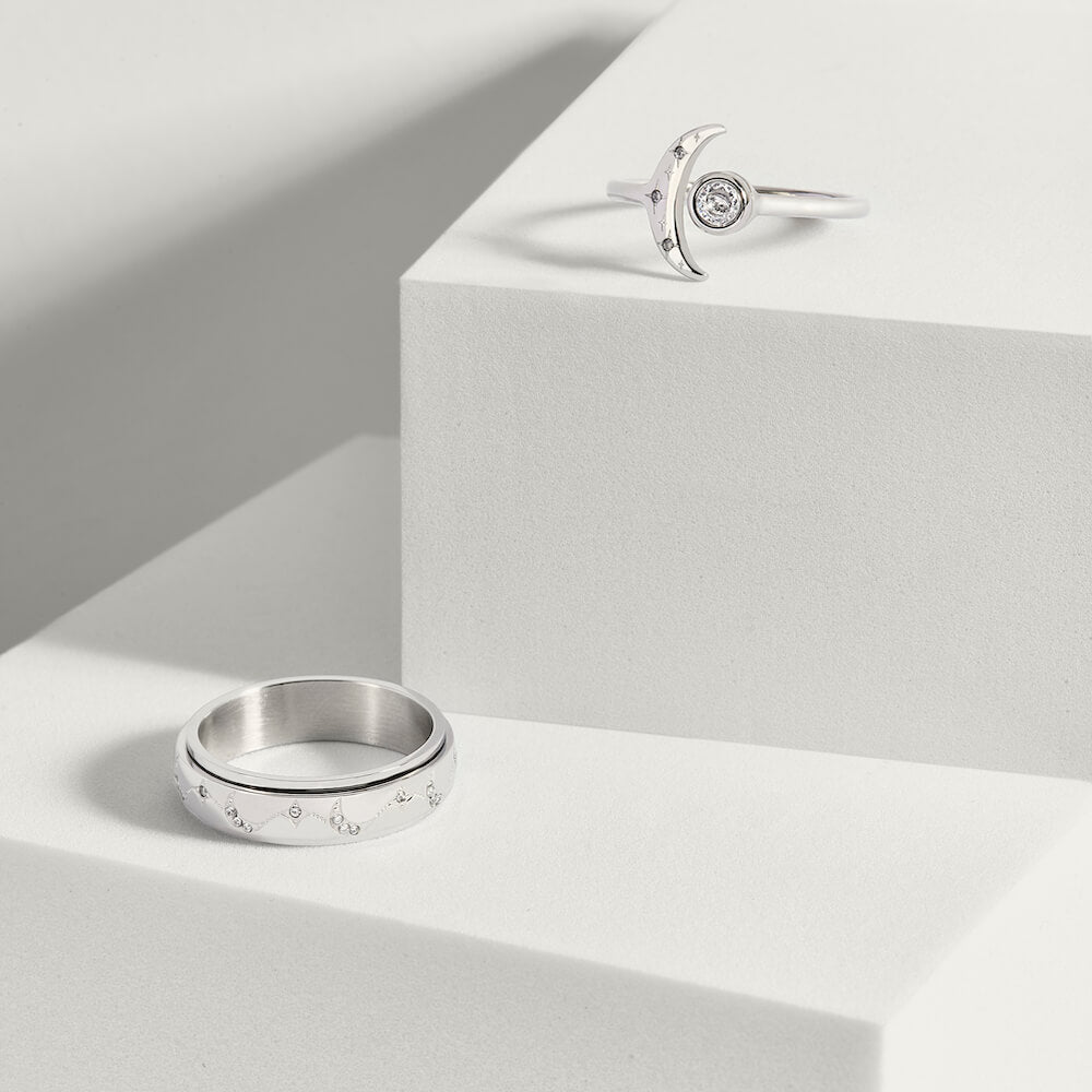 Silver moon and star pattern anxiety ring