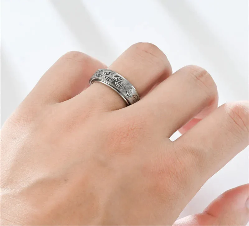 Anillos giratorios vintage con ojos tallados